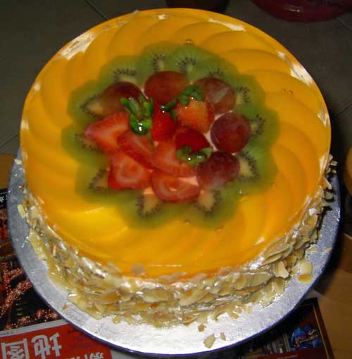 Fruity birthday cake with kiwi mango and strawberry